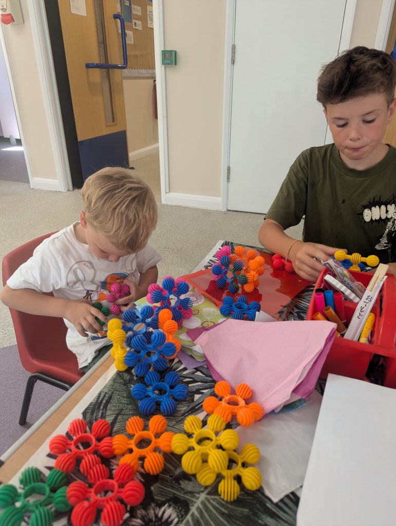 Two young boys playing with construction blocks at Wednesdays at Incredible Kids