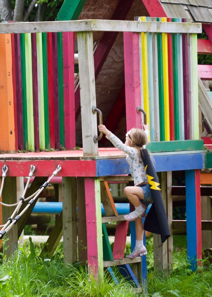 Child climbing on adventure playground 