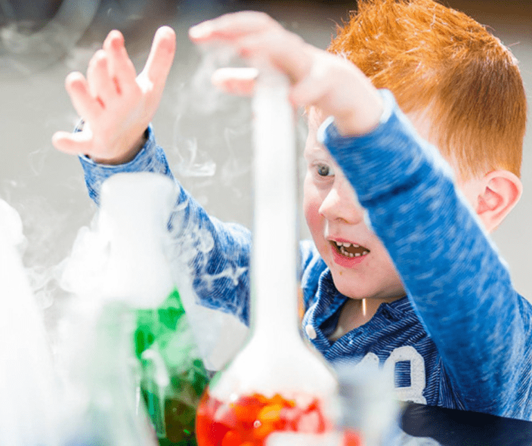 Child touching dry ice